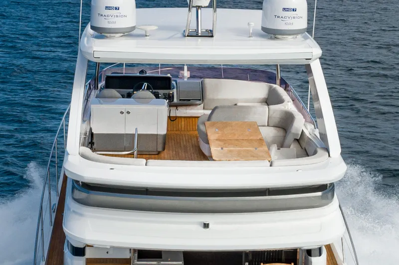 Slide: The Image of Luxury Princess F55 yacht, 2022 model, cruising on the ocean with elegant deck seating. - 25