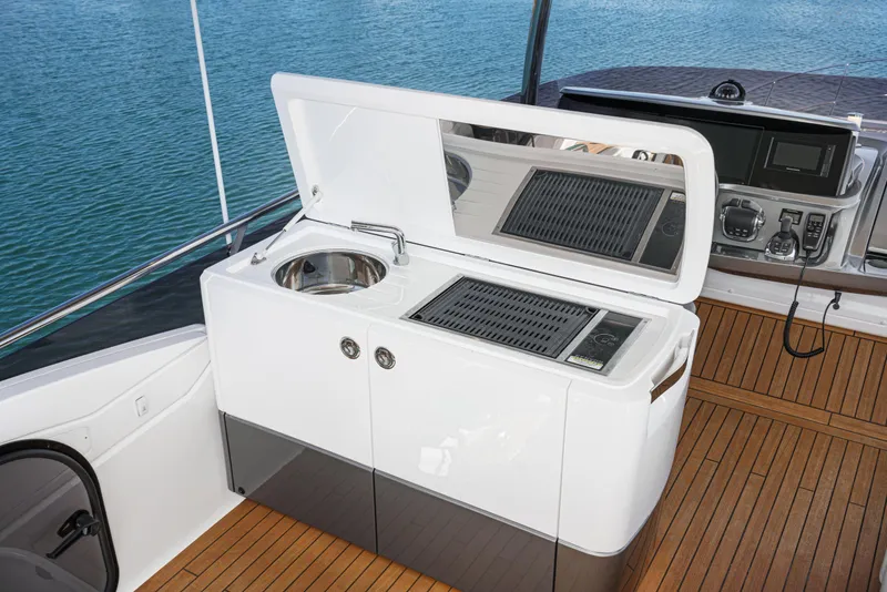 Slide: The Image of Outdoor kitchen on 2022 Princess F55 yacht with sink and grill, overlooking water. - 28