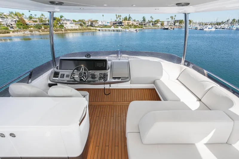 Slide: The Image of Luxurious 2022 Princess F55 yacht interior with elegant seating and scenic waterfront view. - 29