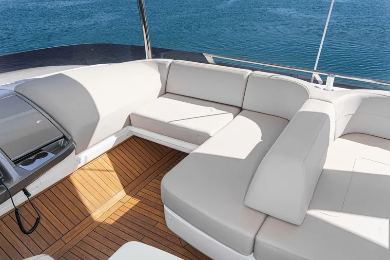 Slide: The Image of Luxurious seating area on 2022 Princess F55 yacht with teak flooring and ocean view. - 33