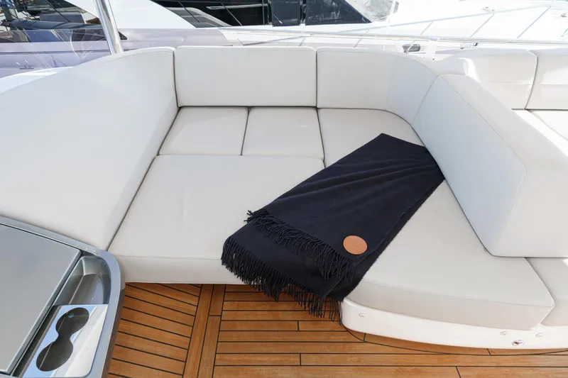 Slide: The Image of Luxurious seating area on 2022 Princess F55 yacht with elegant wooden flooring. - 34