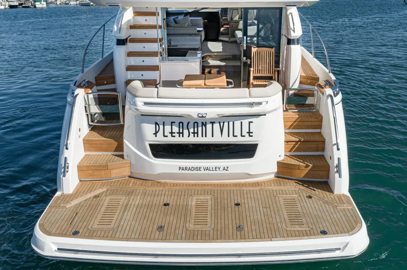 Slide: The Image of Luxury Princess F55 yacht, 2022 model, docked with wooden deck and elegant interior. - 35