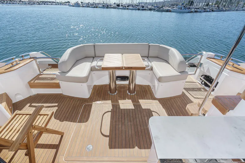 Slide: The Image of Luxurious 2022 Princess F55 yacht deck with elegant seating and wooden flooring. - 37