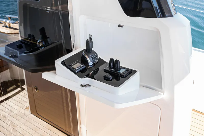 Slide: The Image of Control panel of 2022 Princess F55 yacht with joystick and digital displays. - 41