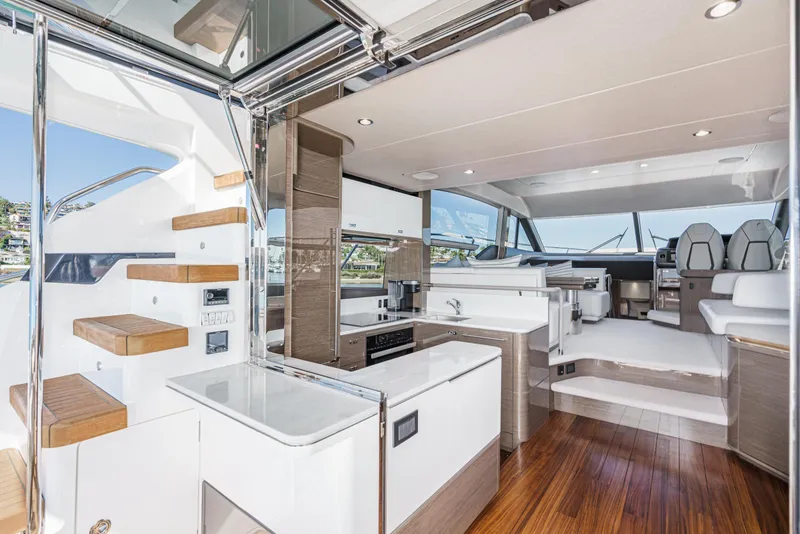 Slide: The Image of Luxurious interior of 2022 Princess F55 yacht with modern kitchen and seating area. - 42