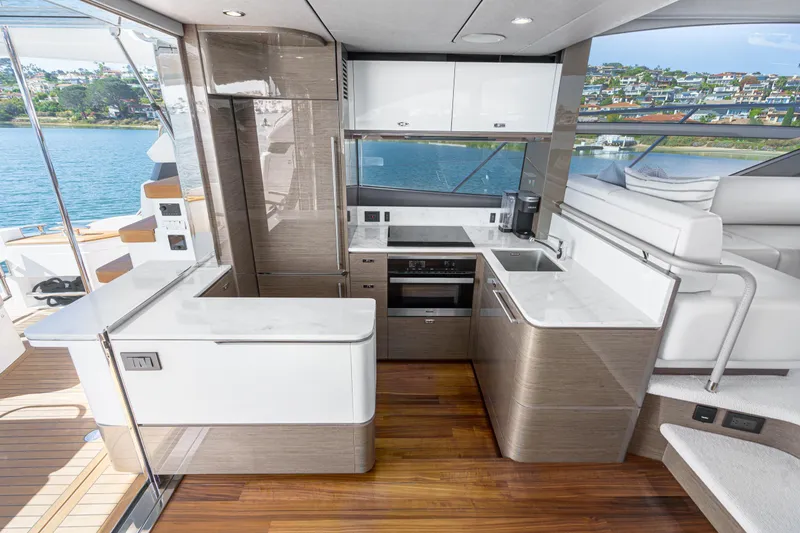 Slide: The Image of Luxurious 2022 Princess F55 yacht kitchen with modern design and scenic water view. - 45