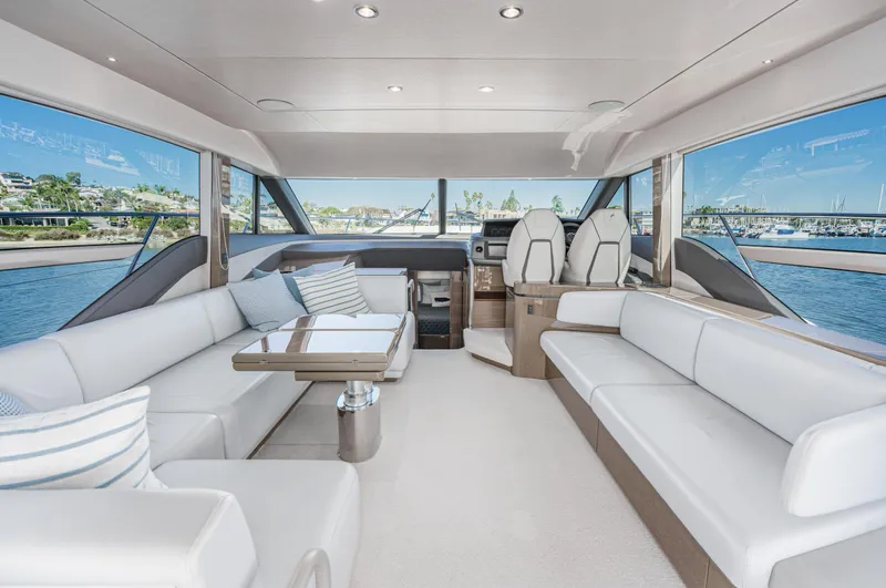 Slide: The Image of Luxurious interior of 2022 Princess F55 yacht with white seating and panoramic windows. - 49