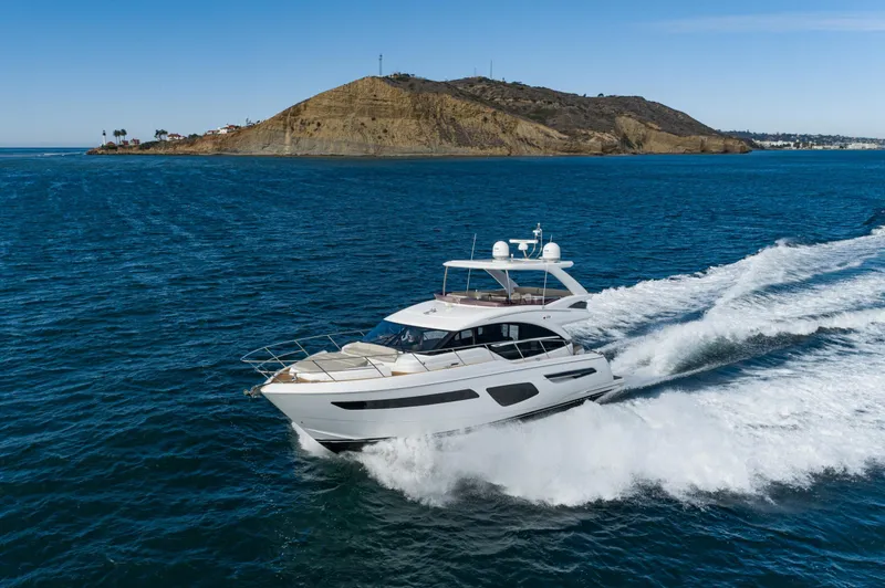 Slide: The Image of Luxury Princess F55 yacht cruising near scenic coastline, 2022 model. - 5