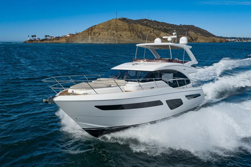 Slide: The Image of Luxury Princess F55 yacht cruising near a scenic coastline, 2022 model. - 6