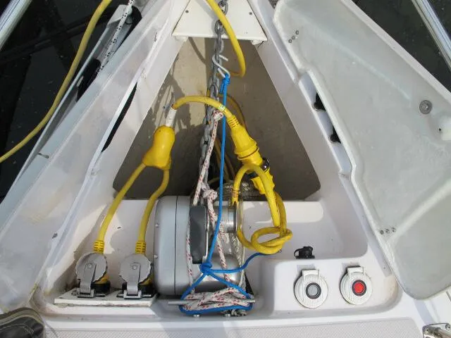 Slide: The Image of Anchor locker of a 2015 Catalina 315 sailboat with yellow power cables and winch. - 8