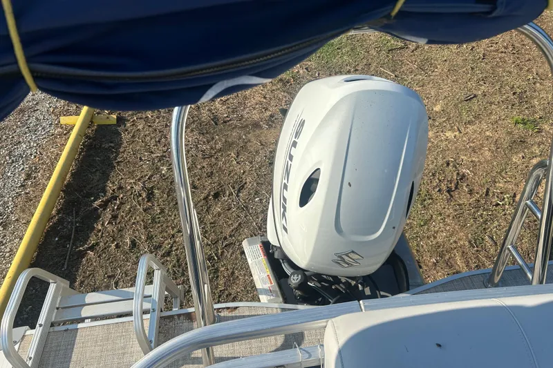 Slide: The Image of 2023 Nepallo 22TL Sport Toon boat with Suzuki outboard motor, viewed from above. - 10