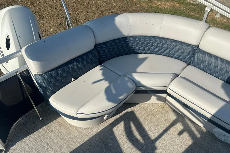 Slide: The Image of 2023 Nepallo 22TL Sport Toon boat with stylish blue and white seating. - 11