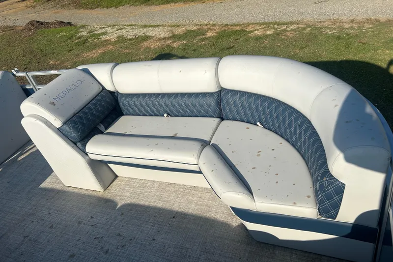 Slide: The Image of 2023 Nepallo 22TL Sport Toon boat seating with blue and white upholstery. - 4