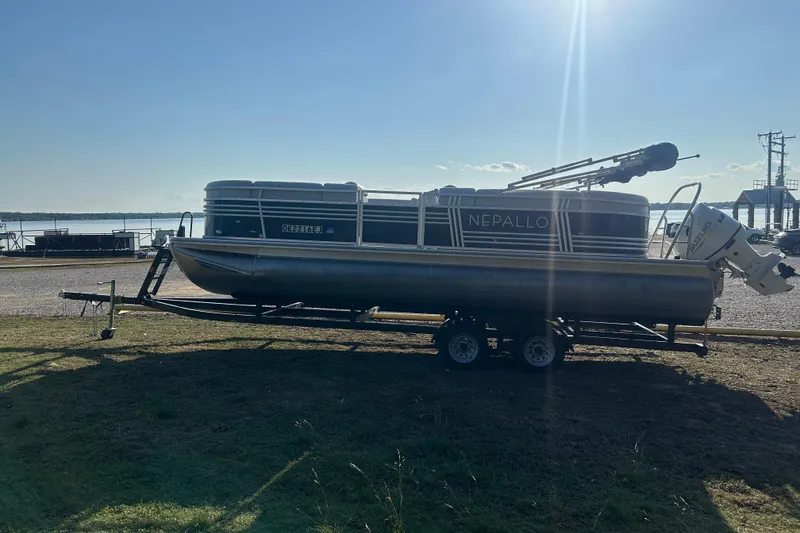 Slide: The Image of 2023 Nepallo 22TL Sport Toon pontoon boat on trailer by a lakeside. - 5