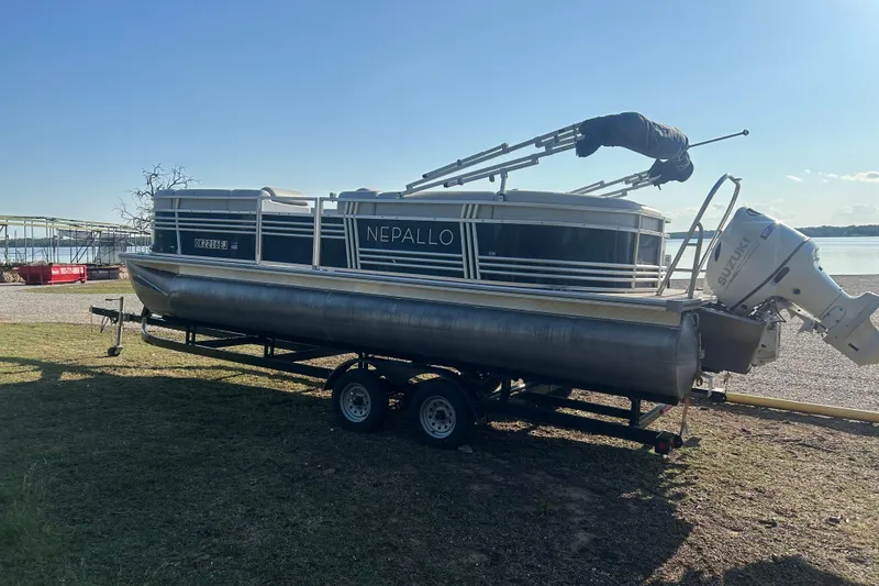 Slide: The Image of 2023 Nepallo 22TL Sport Toon pontoon boat on trailer by a lakeside. - 6