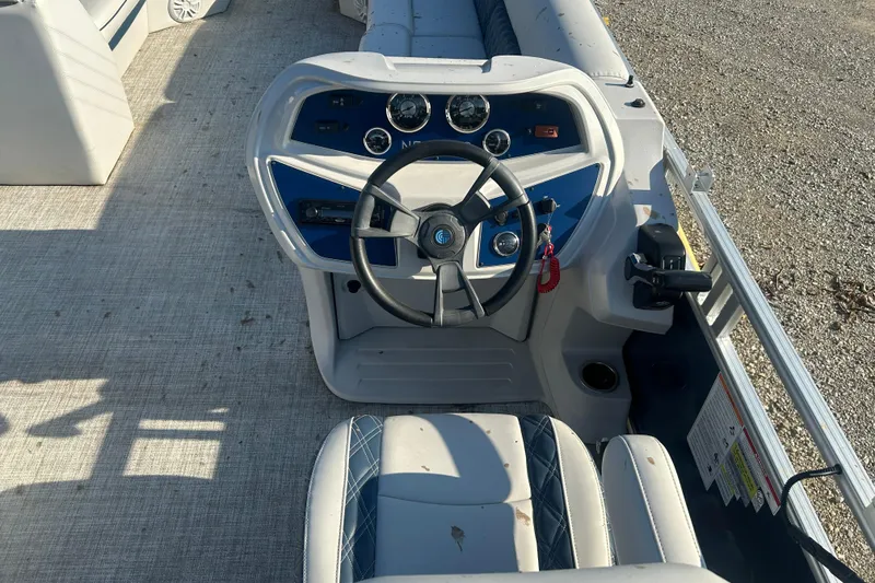 Slide: The Image of Steering console of 2023 Nepallo 22TL Sport Toon boat with gauges and controls. - 9