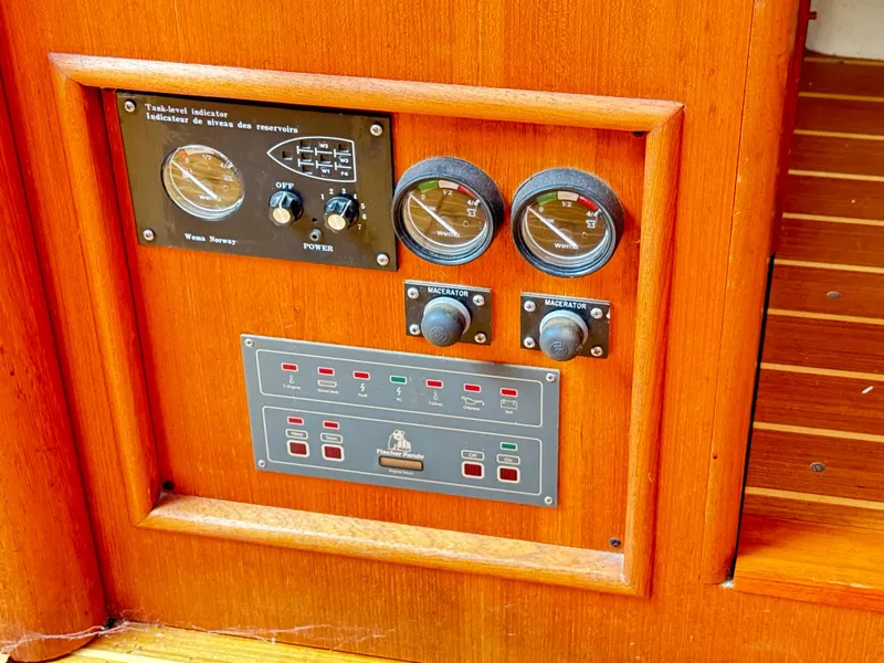 Slide: The Image of Control panel on a 2000 Hunter 410 boat with gauges and switches. - 24