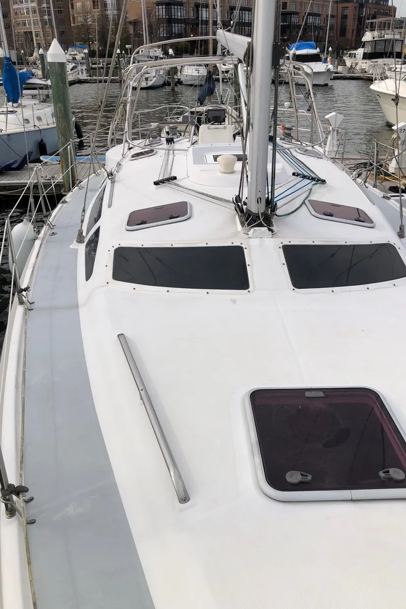 Slide: The Image of Sailboat deck view of 2000 Hunter 410 model in marina setting. - 27