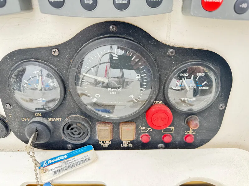 Slide: The Image of Control panel of a 2000 Hunter 410 boat with gauges and switches. - 34