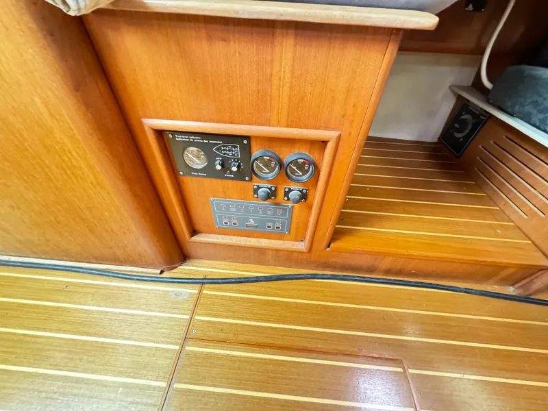Slide: The Image of Control panel on a 2000 Hunter 410 yacht with wooden interior flooring. - 35