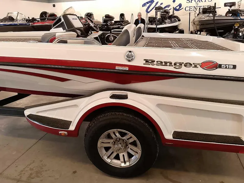 Slide: The Image of 2021 Ranger Z519 SC boat with red and white design in showroom. - 10