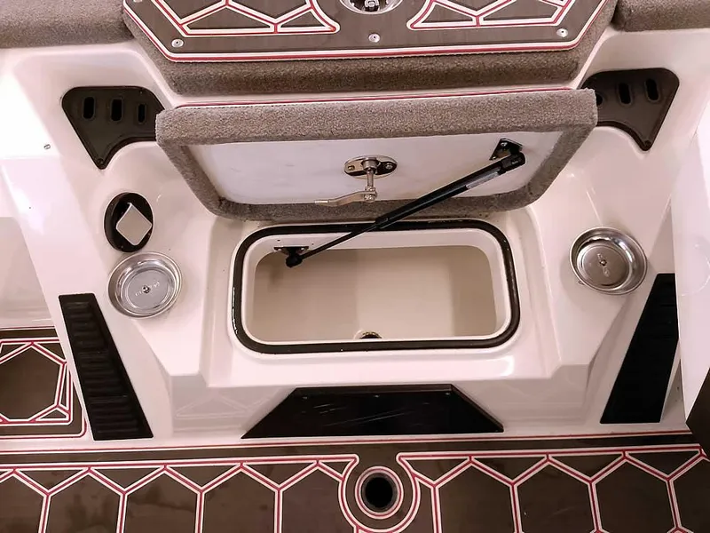 Slide: The Image of 2021 Ranger Z519 SC boat interior with storage compartment and cup holders. - 15