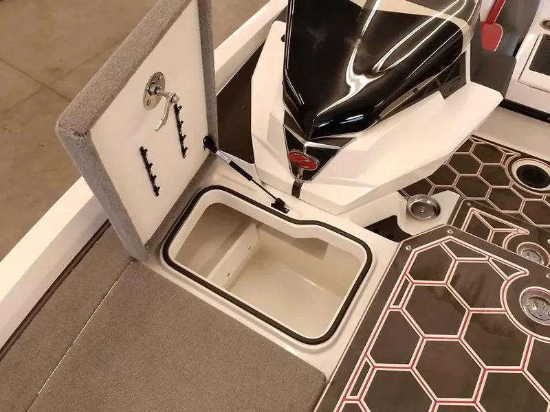 Slide: The Image of 2021 Ranger Z519 SC boat interior with open storage compartment and sleek design. - 17