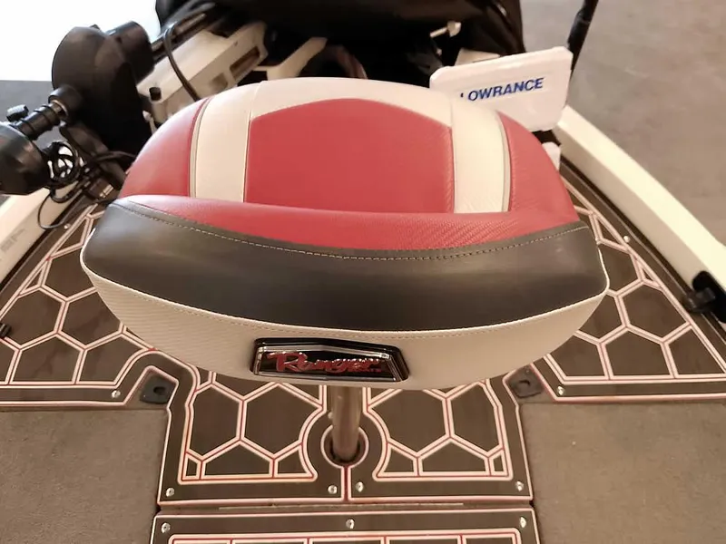 Slide: The Image of 2021 Ranger Z519 SC boat seat with red and white upholstery, featuring a Lowrance device. - 20