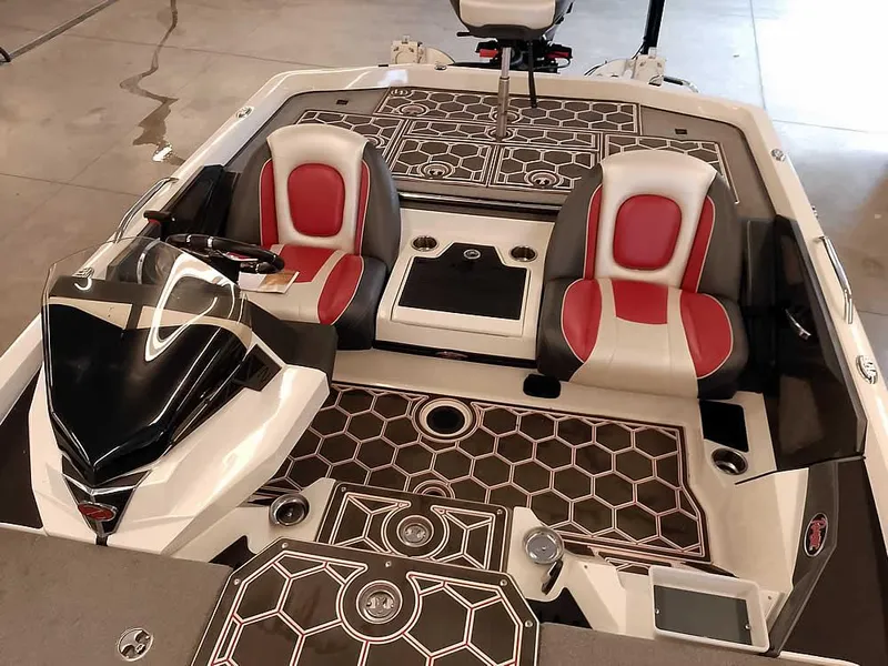 Slide: The Image of 2021 Ranger Z519 SC boat interior with red and white seats, hexagonal floor pattern. - 25