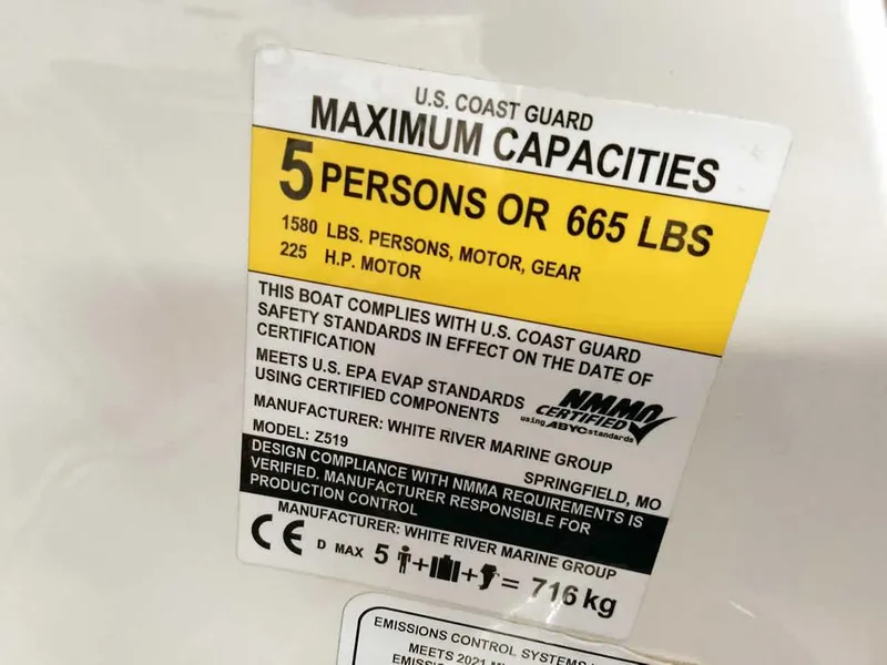 Slide: The Image of U.S. Coast Guard capacity label for 2021 Ranger Z519 SC boat, 5 persons or 665 lbs. - 29