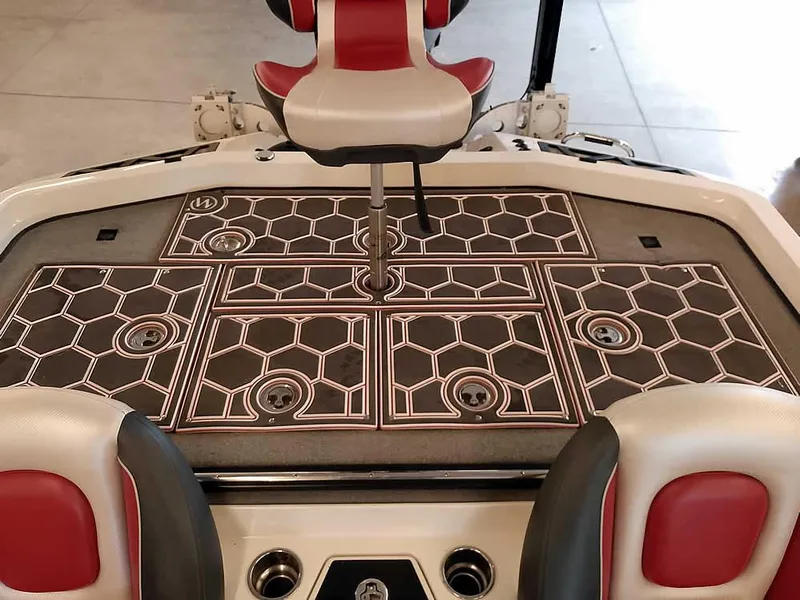 Slide: The Image of 2021 Ranger Z519 SC boat deck with red and white seating, hexagonal pattern flooring. - 40