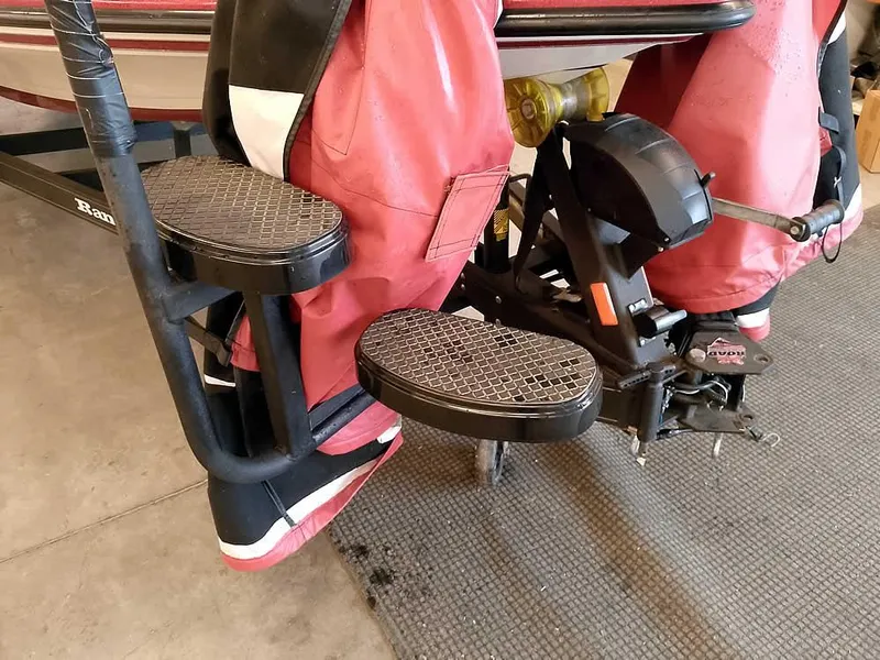 Slide: The Image of 2021 Ranger Z519 SC boat with red seats and black step ladder. - 5