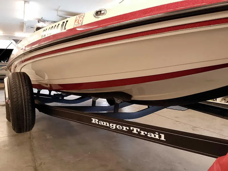 Slide: The Image of 2021 Ranger Z519 SC boat on Ranger Trail trailer in garage. - 6