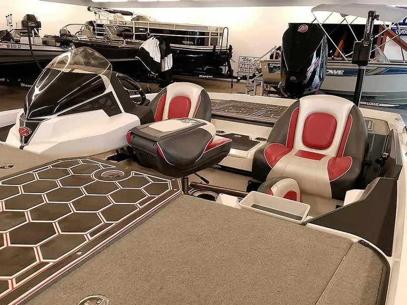 Slide: The Image of 2021 Ranger Z519 SC boat interior with red and gray seating, hexagonal deck pattern. - 9
