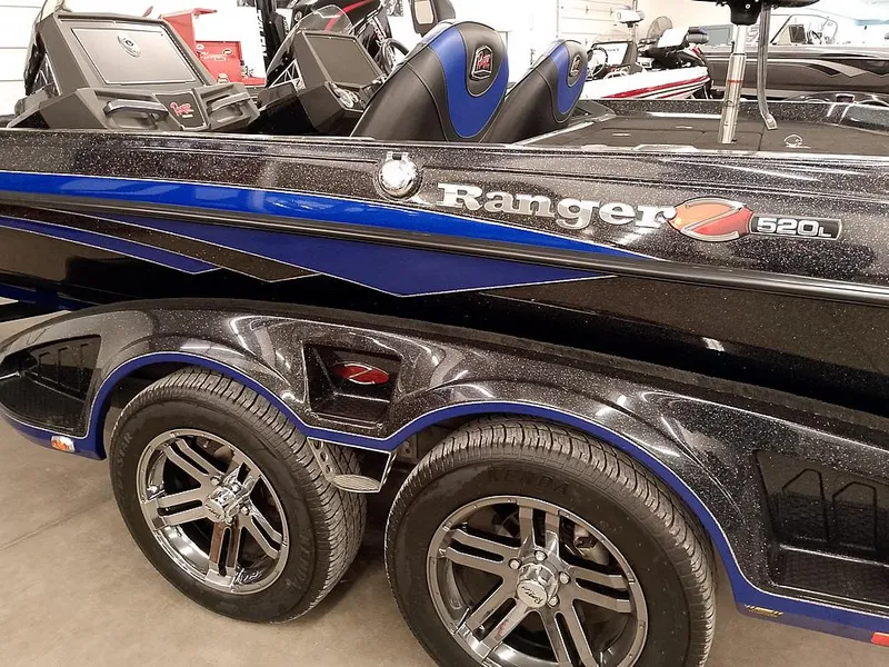 Slide: The Image of 2020 Ranger Z520L Comanche DC boat with sleek design and dual wheels. - 10