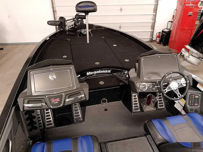 Slide: The Image of 2020 Ranger Z520L Comanche DC boat interior with dual consoles and blue seating. - 14