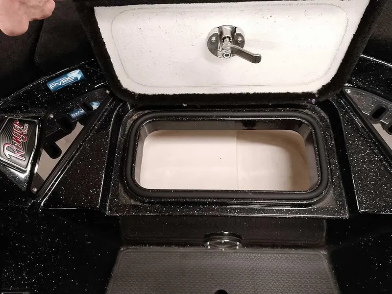 Slide: The Image of 2020 Ranger Z520L Comanche DC boat storage compartment with open lid and latch. - 15