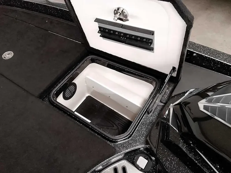 Slide: The Image of 2020 Ranger Z520L Comanche DC boat storage compartment, open lid, black and white interior. - 17