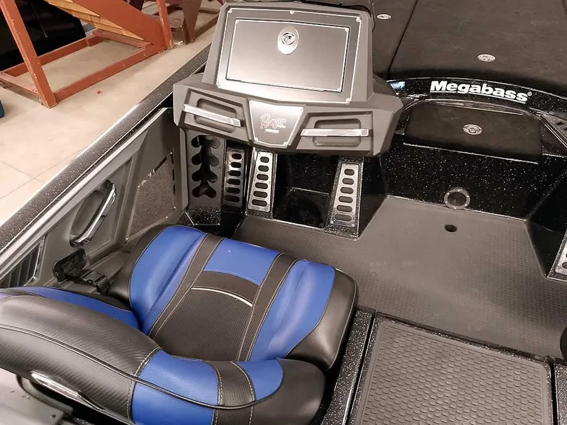 Slide: The Image of 2020 Ranger Z520L Comanche DC boat interior with blue and black seating and control panel. - 24