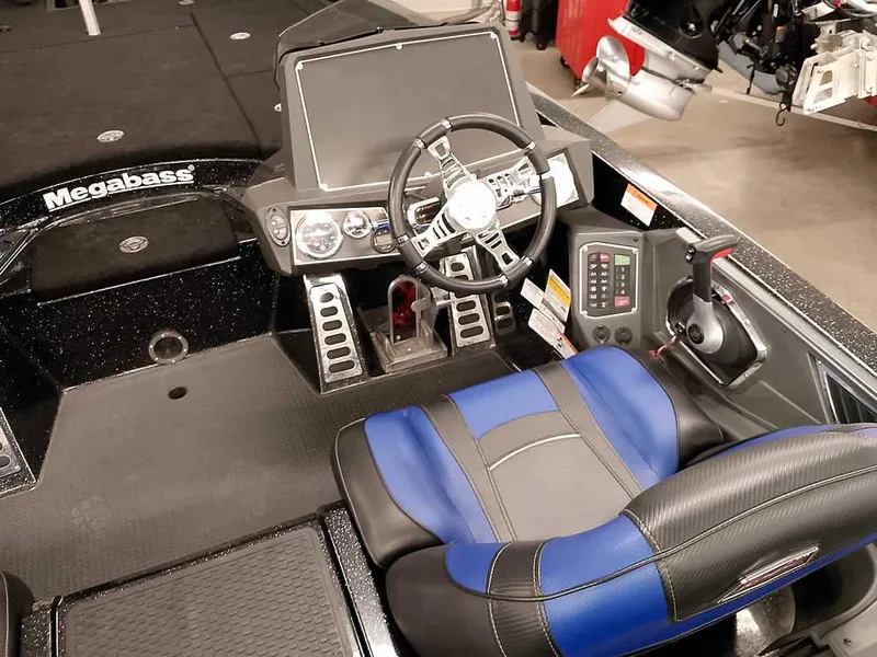 Slide: The Image of 2020 Ranger Z520L Comanche DC boat cockpit with steering wheel and blue seat. - 27