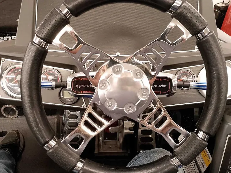Slide: The Image of Steering wheel of 2020 Ranger Z520L Comanche DC boat, featuring sleek metallic design. - 29