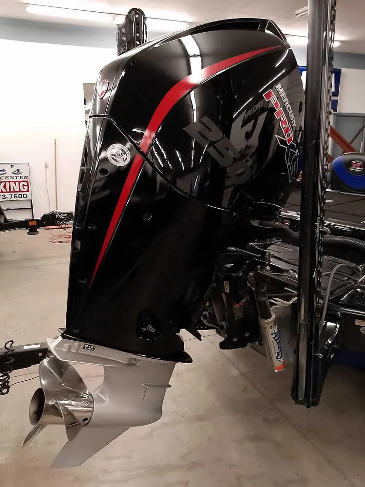 Slide: The Image of 2020 Ranger Z520L Comanche DC boat engine in a garage setting. - 3