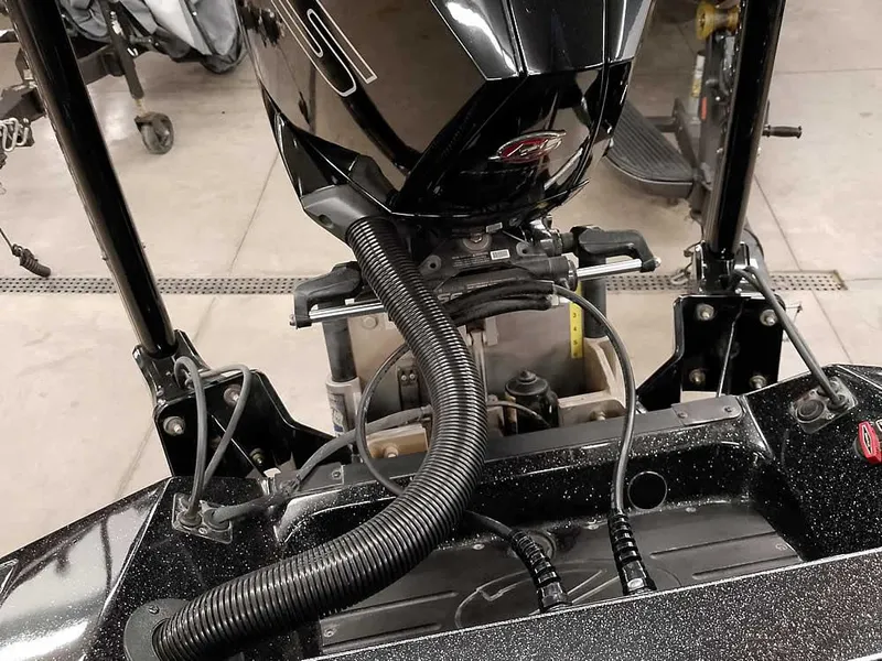 Slide: The Image of 2020 Ranger Z520L Comanche DC boat engine and components in a workshop setting. - 35