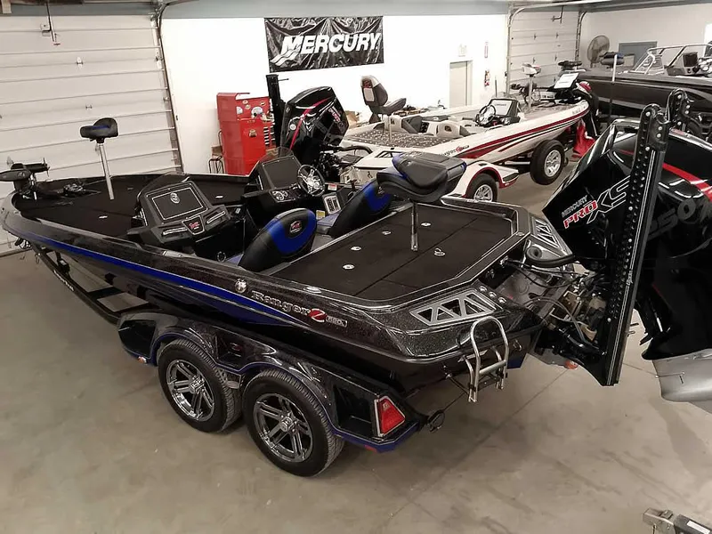 Slide: The Image of 2020 Ranger Z520L Comanche DC boat in showroom, featuring dual consoles and sleek design. - 37