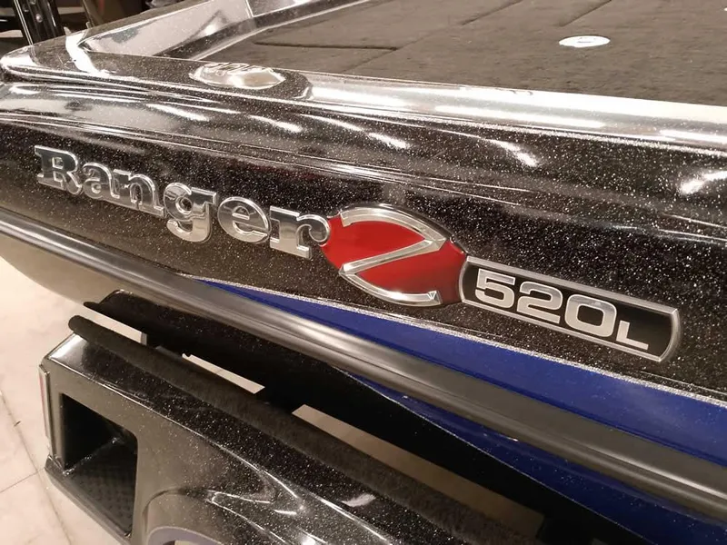 Slide: The Image of 2020 Ranger Z520L Comanche DC boat, close-up of model emblem and sleek design. - 4