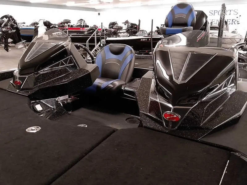 Slide: The Image of 2020 Ranger Z520L Comanche DC boat with sleek black design and blue-accented seats. - 9