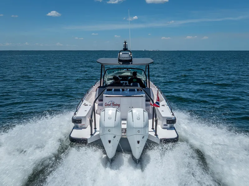 Slide: The Image of 2022 Axopar 28 T-Top Brabus cruising on open water, rear view. - 12