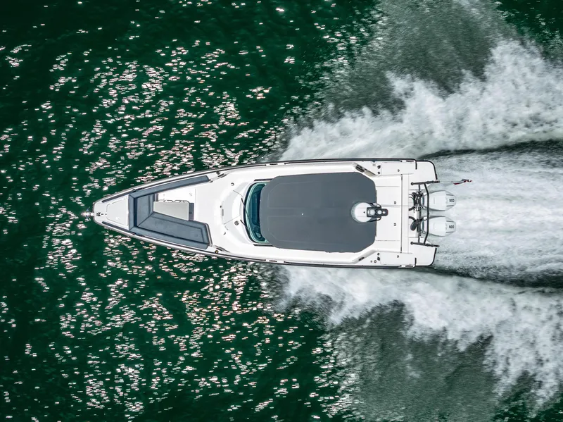 Slide: The Image of Overhead view of 2022 Axopar 28 T-Top Brabus speeding on water. - 17