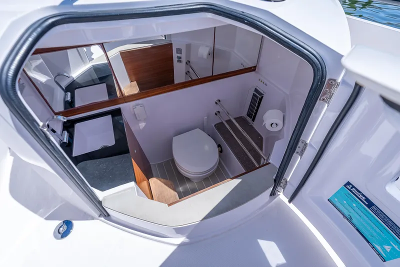 Slide: The Image of Interior view of 2022 Axopar 28 T-Top Brabus boat bathroom. - 22