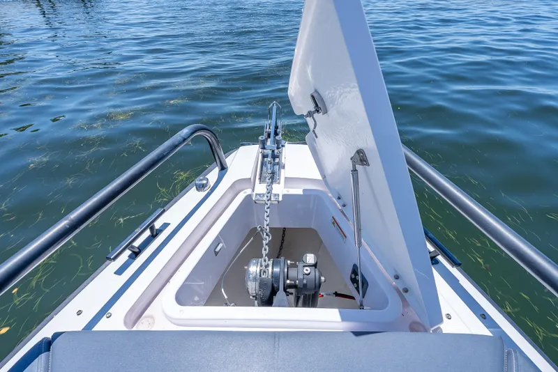 Slide: The Image of Anchor compartment of 2022 Axopar 28 T-Top Brabus on water. - 24